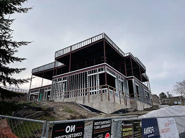 a view looking up at a 2 story building under construction